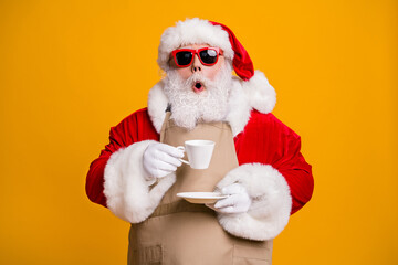 Close-up portrait of his he nice attractive amazed wondered astonished Santa shop owner businessman drinking cappuccino cafe cafeteria taste isolated bright vivid shine vibrant yellow color background