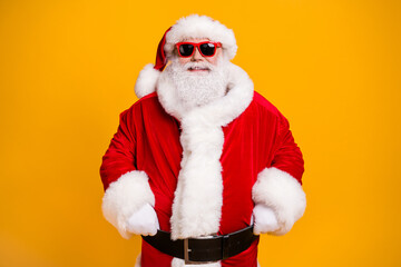 Portrait of his he nice attractive cheerful cheery Santa father ho-ho-ho festal mood newyear celebratory day isolated over bright vivid shine vibrant yellow color background