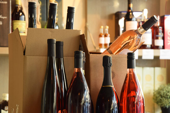 Wine bottles in wine store and ready for home delivery