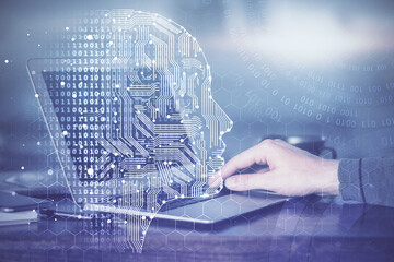 Man typing on keyboard background with brain hologram. Concept of big Data. Double exposure.