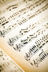 Obraz premium Vintage yellow paper sheet with musical notes.