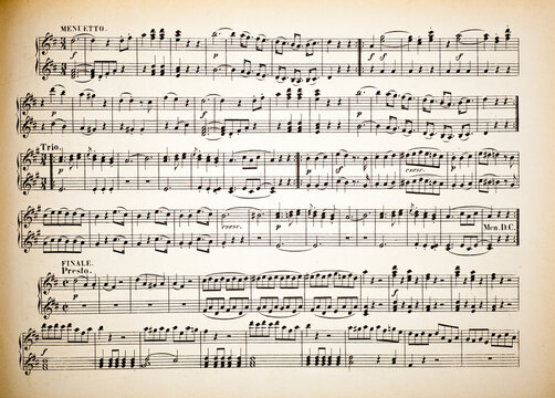 Vintage yellow paper sheet with musical notes.
