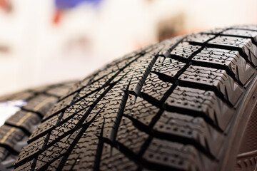 A stack of winter tires. All-season tires. Car tires in store