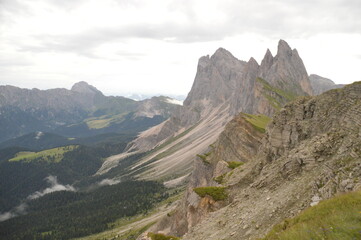 Hiking on the dramatic mountain ridge of Seceda in South Tyrol's Dolomites, Northern Italy