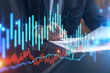 Businessman in suit signs contract. Double exposure with forex graph hologram. Man signing brokerage agreement. Financial market analysis and investment concept.