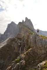 Naklejka premium Hiking on the dramatic mountain ridge of Seceda in South Tyrol's Dolomites, Northern Italy