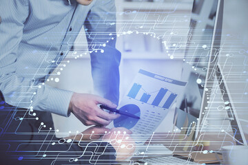 Multi exposure of tech drawings with man working on computer background. Concept of innovation.