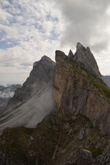 Hiking on the dramatic mountain ridge of Seceda in South Tyrol's Dolomites, Northern Italy