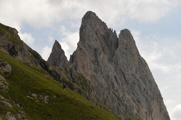 Hiking on the dramatic mountain ridge of Seceda in South Tyrol's Dolomites, Northern Italy