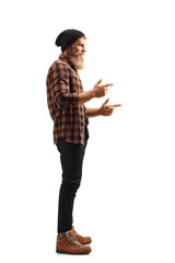 Full length profile shot of a bearded guy standing and gesturing with both hands