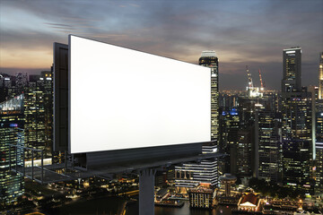 Blank white road billboard with Singapore cityscape background at night time. Street advertising poster, mock up, 3D rendering. Side view. The concept of marketing communication to sell idea.