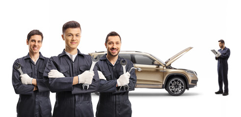 Team of auto mechanic workers with a SUV