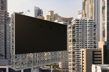 Obraz premium Blank black road billboard with Bangkok cityscape background at day time. Street advertising poster, mock up, 3D rendering. Side view. The concept of marketing communication to promote or sell idea.