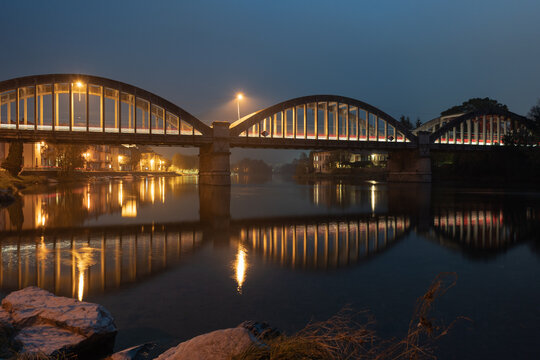 Brivio bridge at night with reflection in the Adda river