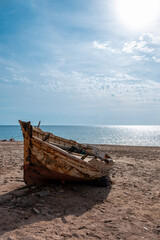 abandoned boat on the beach
