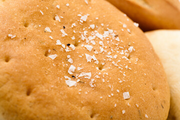 Close up of salty fresh baked wheat bread.