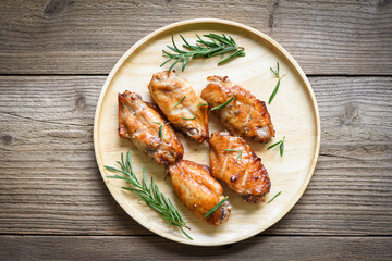 Baked chicken wings with sauce and herbs and spices cooking thai asian food rosemary chicken grilled /