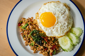 basil rice and friied egg is thai cuiisine