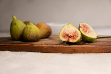 fresh figs on wooden table. Life style. figs cut on a wooden Board. copy space.