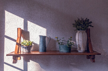 Home decor in Provence style. Wall shelf with vase and flowers	