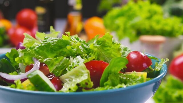 Fresh salad with vegetables and greens, healthy organic diet food from fresh ingredients, with copy space