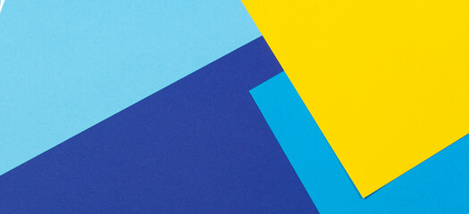 Abstract light blue and yellow color geometric paper compositon banner background, top view