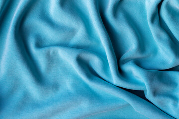 Jersey cotton fabric texture. Crumpled blue textile background