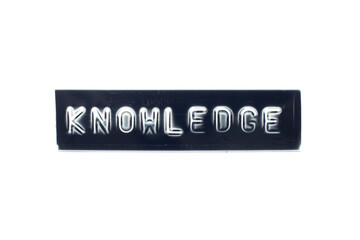 Embossed letter in word knowledge on black banner with white background