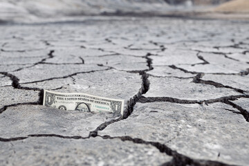 money and cracked ground perspective bottom view