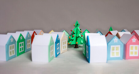 Origami advent calendar. Miniature with Christmas tree and paper houses, seasonal craft