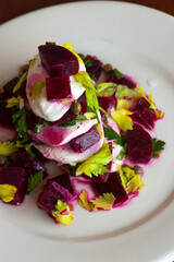 Beet salad. Classic Italian salad with beets, mozzarella, spinach, arugula, Parmesan cheese, olive oil, lemon juice, salt and pepper. A Fine dining restaurant classic.