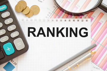  the word rankingis written on a notepad with a calculator. the concept of rating firms, managers,...