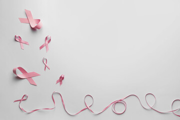 Fototapeta na wymiar Pink ribbons on white background. Breast cancer awareness concept