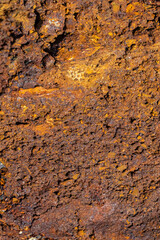Rough texture of mountain wild stone. Marble. Granite. Stone abstraction. Mountain stone. The rough surface of an ancient mountain. Grunge texture. Laminated surface. Abstract grunge background.