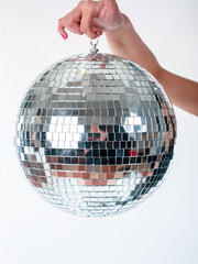 Hand holding Disco Ball dance music event equipment