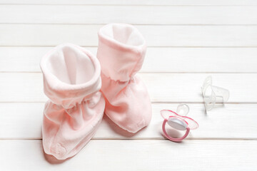 Pink socks and baby pacifier. Fashion accessories for girl newborn