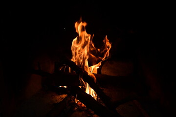 firewood's burn in a fire-place a fire