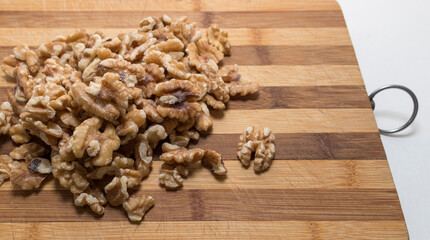 Walnuts on a wooden board, close-up