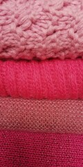 
background of pink knitted sweaters