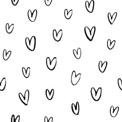 Vector seamless heart pattern. Valentine's Day black paint ornament. Hand drawn abstract seamless background with small and simple hearts. Black and white vector wallpaper. Wrapping paper, gift, print