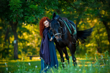 cosplay Braveheart red curly girl with a horse in the woods