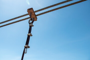 Sling of the bridge, The steel rope of the suspension bridge and the blue sky background