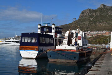 fishing boats in the harbor of Hout Bay Cape Town South Africa.