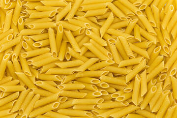 Penne italian pasta as background
