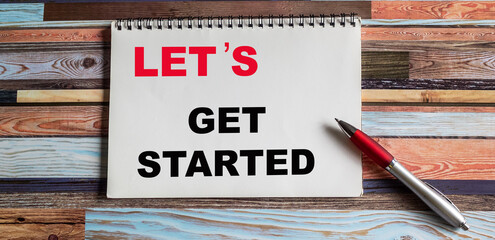A text sign that says Let S Is Get Started . Conceptual photography encourages a demonstration or group to start doing something, motivational call
