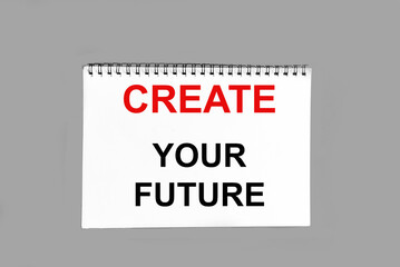 Create your future, text is written on white sticky note and gray background.