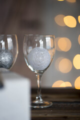 two glasses made of transparent glass stand on the table