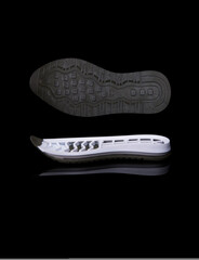 white shoe sole. Isolated on a black background.