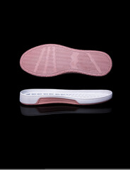 white shoe sole. Isolated on a black background.