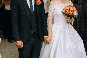 bride and groom holding hands wedding ceremony